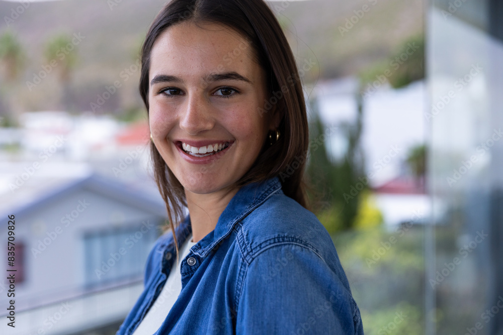 At home, young Caucasian woman smiling while enjoying spa day on balcony At home, young Caucasian woman smiling while enjoying spa day on balcony