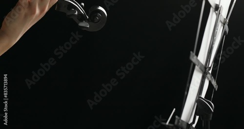 Pan sweeps young, fuchsia-haired violinist, intense focus