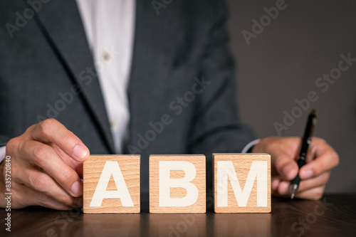 There is notebook with the word ABM. It is an abbreviation for Account Based Marketing as eye-catching image.