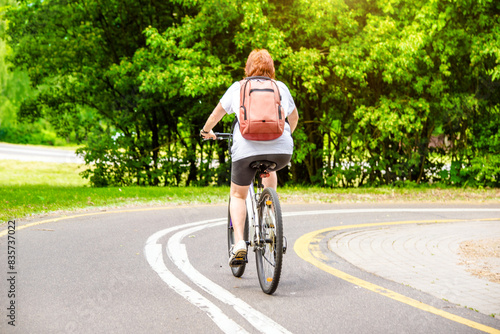 Wallpaper Mural Cyclist ride on the bike path in the city Park Torontodigital.ca