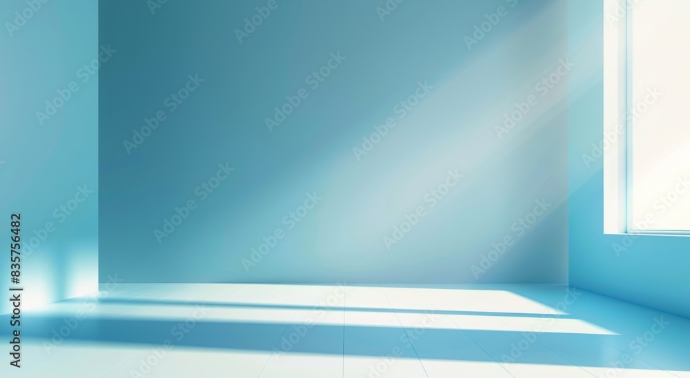 Abstract light blue background with a soft gradient, a white spotlight and rays of light on an empty studio room wall for a product display presentation design Abstract light blue background with a soft gradient, a white spotlight and rays of light on an empty studio room wall for a product display presentation design
