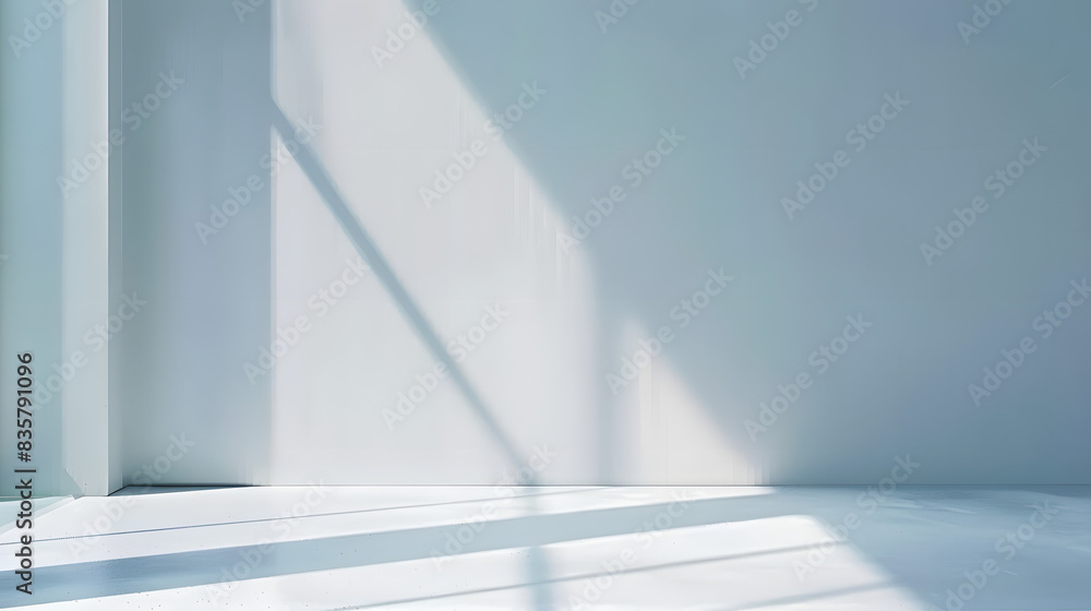 Light minimalist geometric background image in gray and light blue tones with light and shadow from window for product presentation. Light minimalist geometric background image in gray and light blue tones with light and shadow from window for product presentation.