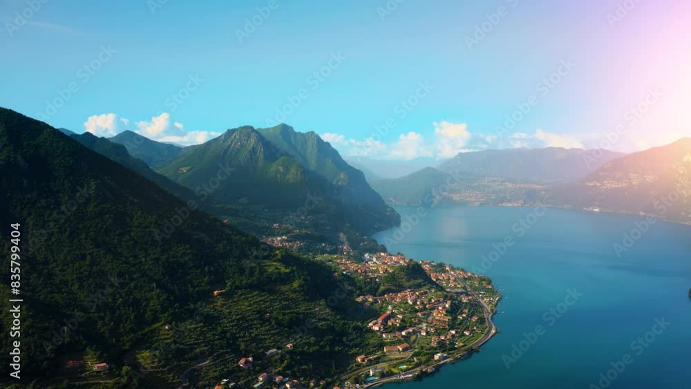 Aerial view of Italian town of Limone Sul Garda on Lake Garda, Italy. Limone Town in Italy on the Lake Garda, beautiful mountain views, old town red roofs, green lake. Aerial view of Italian town of Limone Sul Garda on Lake Garda, Italy. Limone Town in Italy on the Lake Garda, beautiful mountain views, old town red roofs, green lake.