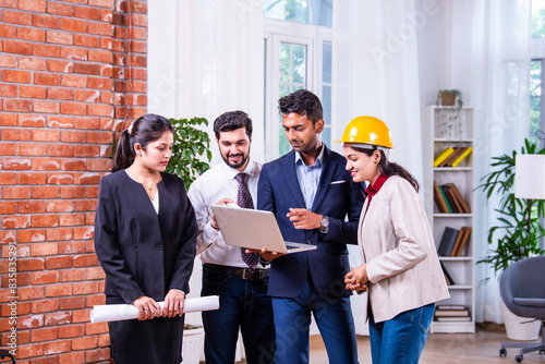 Photography Group photo of Indian asian construction company employees looking at camera