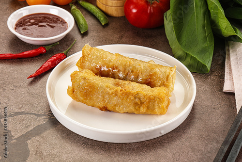 Vietnamese stuffed spring roll served sauce