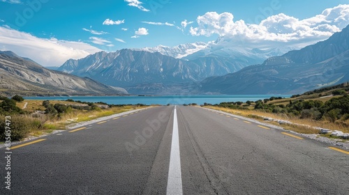 Main viewpoint of a road with mountains in the backdrop photo