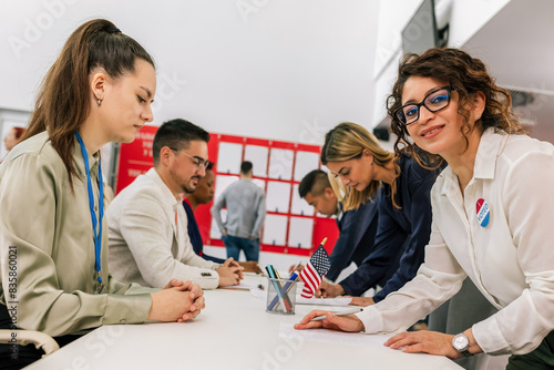 Election commission on the election day. Diverse citizens at ballot station on election day.