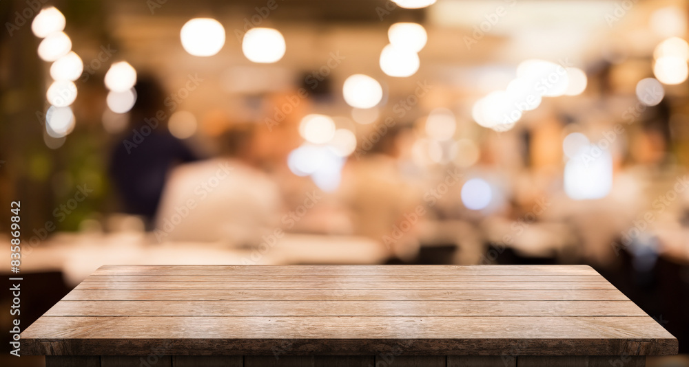 Empty wooden table top with lights bokeh on blur restaurant background. Empty wooden table top with lights bokeh on blur restaurant background.
