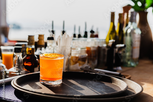 Fresh cocktail with orange juice at the bar counter. photo