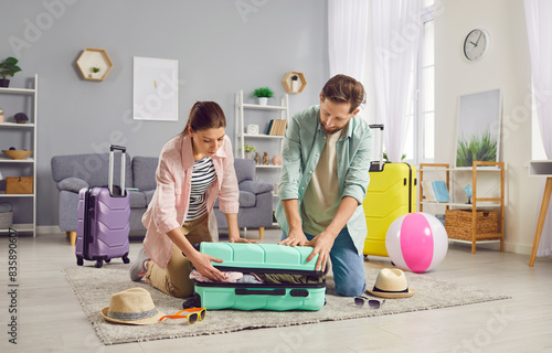 Upcoming adventure couple joyfully packing bags selecting items to pack their bags for journey ahead. Carefully chosen holds new experiences cherished memories together in vacation with packing bags photo