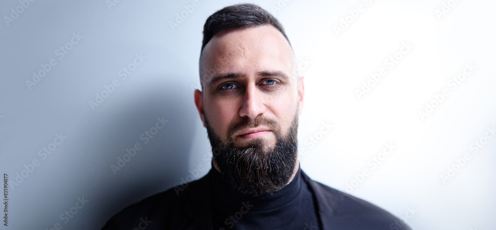 Obraz premium Studio portrait of young handsome man with beard.