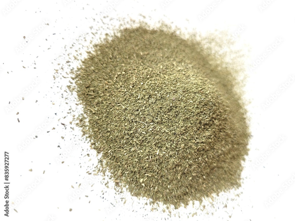 Dried pile of lovage leaves on a white background. Dried pile of lovage leaves on a white background.