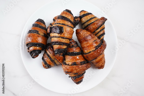 Delicious fresh baked Rugelach with chocolate filling on plate