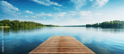 pontoon pier on the lake shore on a beautiful summer day. Creative banner. Copyspace image