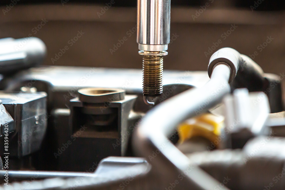 Combustion engine vehicle maintenance, replace of spark plugs Combustion engine vehicle maintenance, replace of spark plugs