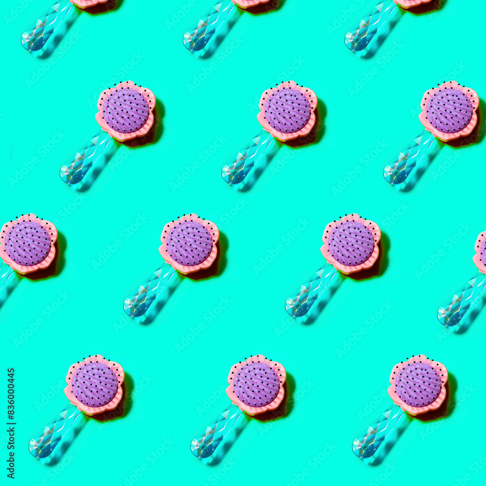 pattern of hairbrush hair combs flat lay on a cyan background from above pattern of hairbrush hair combs flat lay on a cyan background from above
