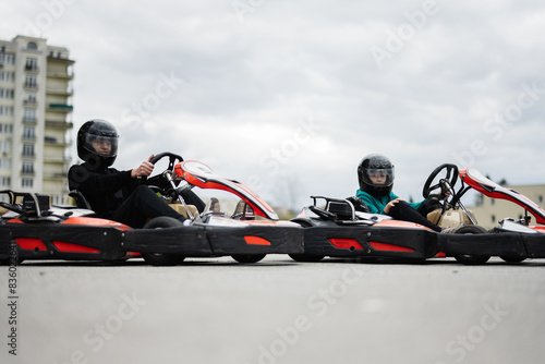 Children Enjoying Go-Kart Racing Outdoors for a Fun and Exciting Adventure photo