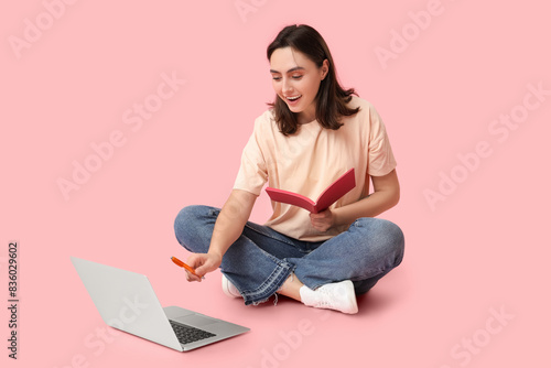 Pretty young woman with lap...