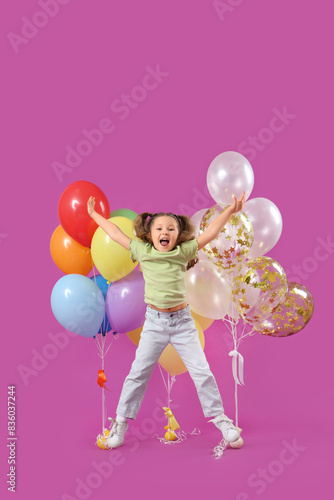 Cute jumping little girl wi...