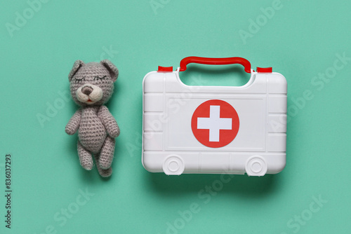 Toy first aid kit and teddy...