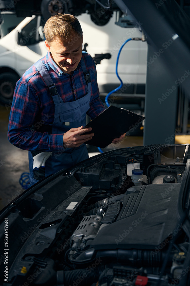 Male performing work with transport in tire fitting Male performing work with transport in tire fitting