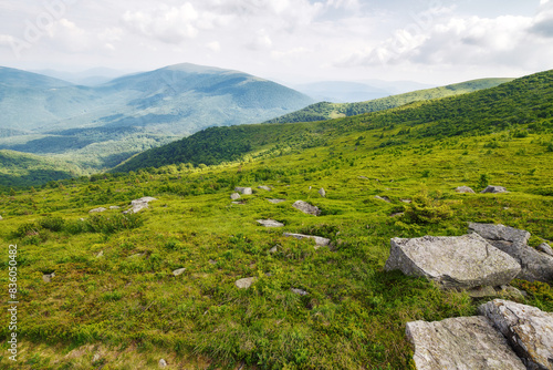 Obraz na płótnie beautiful scenery of mountainous countryside in summer. view in to the distant valley. outdoor adventures in carpathian mountains of ukraine on a cloudy day w salonie
