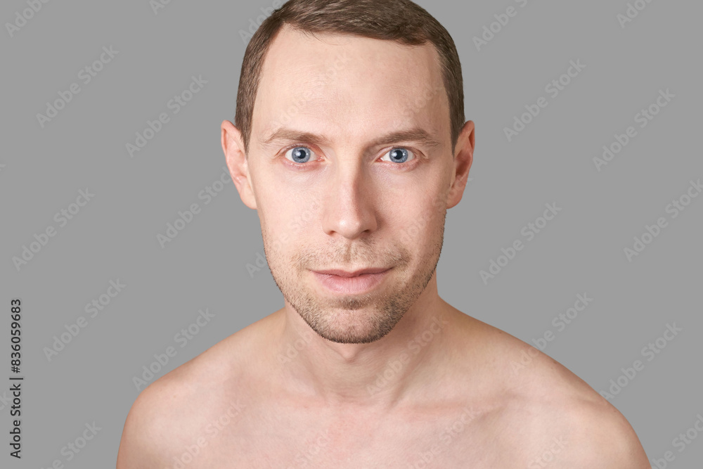 Serious european man. Beauty cosmetology portrait. Calm health relax concept. Opened eyes. Smile male person. Dream about travel. Clean skin procedure. Laugh handsome adult. Grey background. Serious european man. Beauty cosmetology portrait. Calm health relax concept. Opened eyes. Smile male person. Dream about travel. Clean skin procedure. Laugh handsome adult. Grey background.