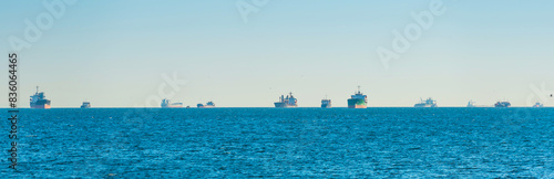 Obraz na płótnie Many transport ships on blue sea, tanker cargo ships panorama w salonie