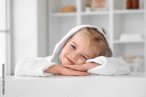 Cute little girl in bathrob...