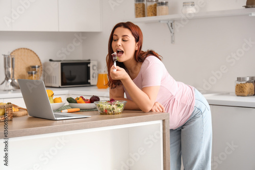 Young woman eating fresh sa...