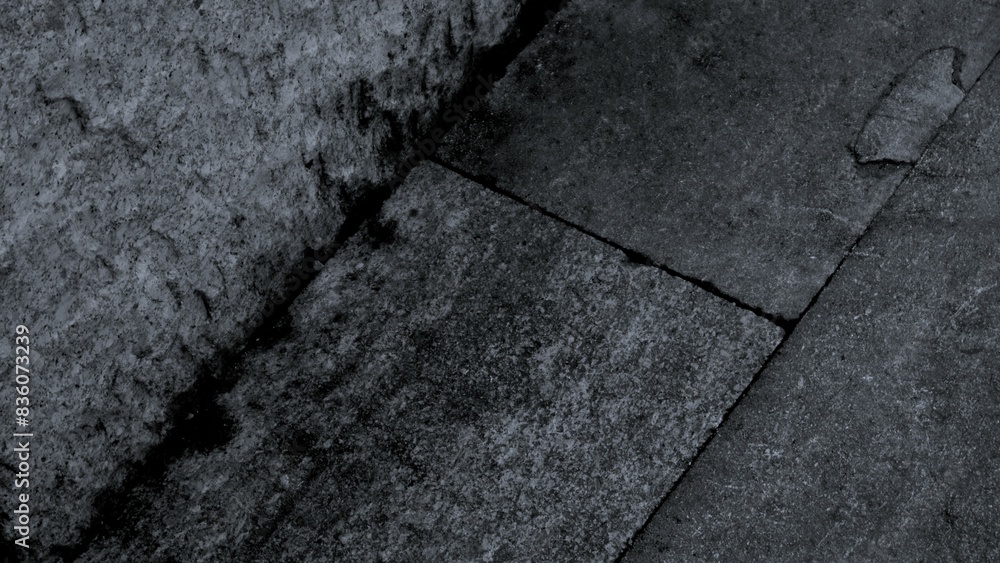 Obraz premium Black or dark gray rough grainy stone texture background with geometric line feature, copy space