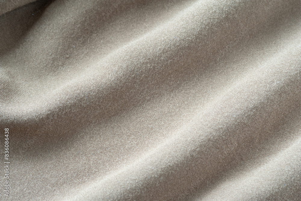 Fototapeta premium Fabric texture with folds. Natural cotton fabric. Folds in fabric
