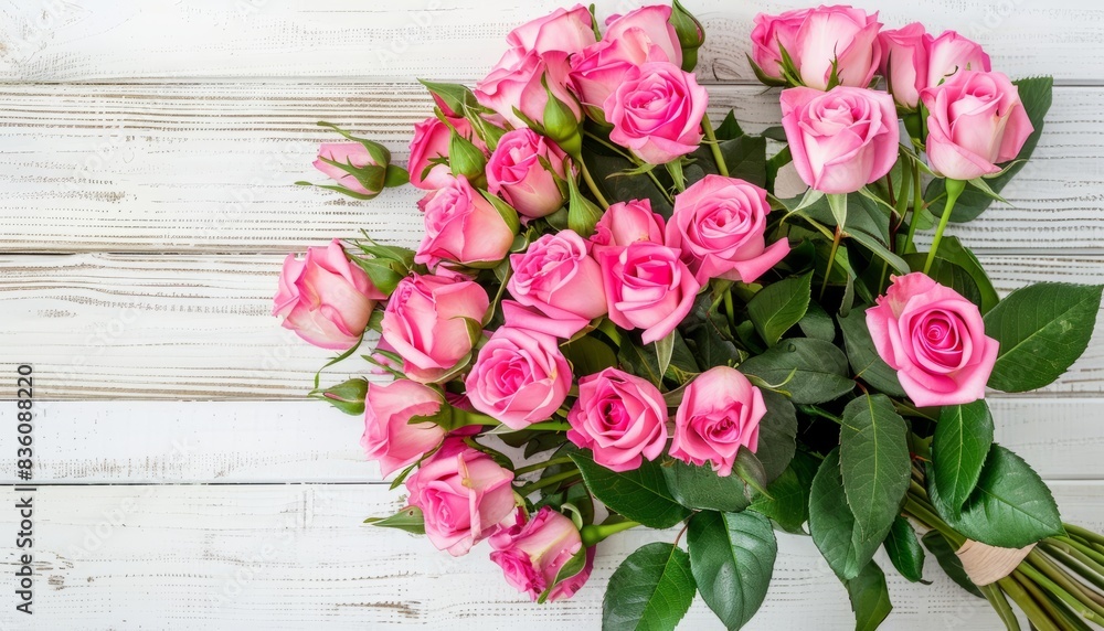 Pink Roses Delight: A Top View of a Bouquet on a White Wooden Background Pink Roses Delight: A Top View of a Bouquet on a White Wooden Background