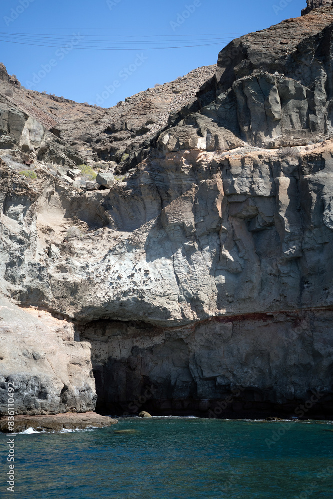 Several caves on a cliff in Puerto de Mogan, Gran Canaria Spain.