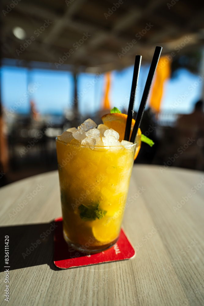 Mango mojito perfect summer drink with ice on top and lemon slice