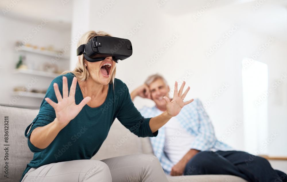 Obraz premium Couple, home and happy with vr for games on sofa for online video challenge and fun. Metaverse experience, futuristic and technology on couch for gaming, contest and competition or hobby as people