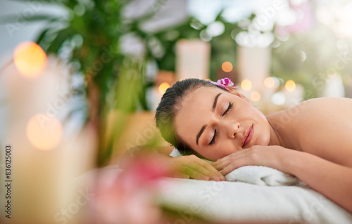Face  massage and woman sleeping on spa bed to relax for health  peace or wellness in resort. Beauty  stress relief or wellbeing with client eyes closed in clinic or salon for natural treatment