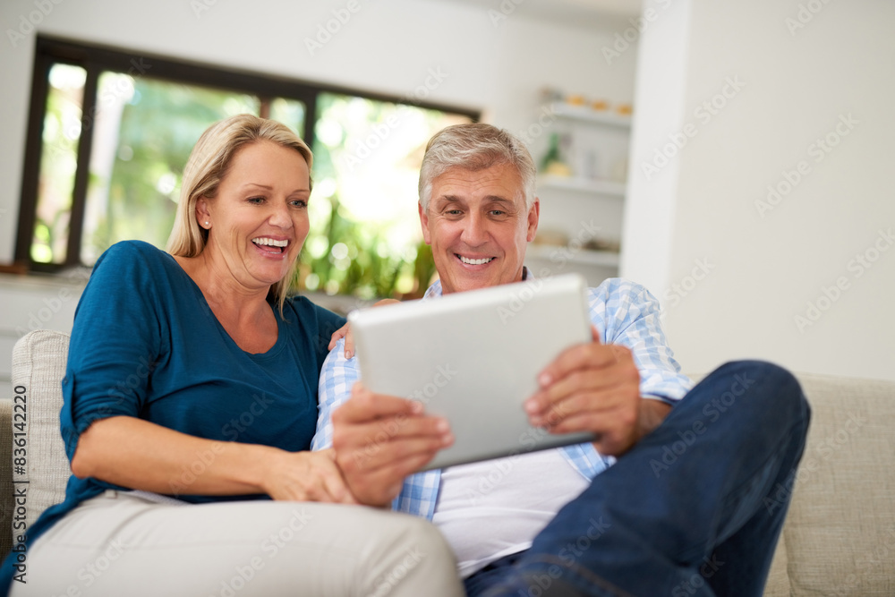 Couple, read and tablet on sofa for social media, laugh and meme online on couch. Technology, internet and app on digital website in home, man and woman person in lounge with touchscreen for comedy Couple, read and tablet on sofa for social media, laugh and meme online on couch. Technology, internet and app on digital website in home, man and woman person in lounge with touchscreen for comedy