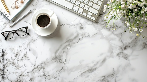 Marble office desk table with office supplies, coffe cup, eye glasses, keyboard. Top view with copy space, flat lay