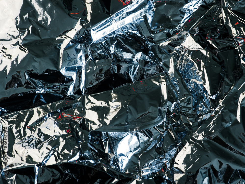 Silver crumpled foil texture for abstract background. Silver crumpled foil texture for abstract background.