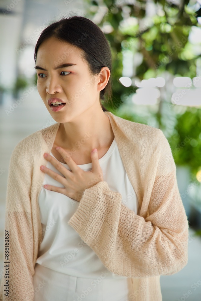 ill Asian woman with acid reflux or gerd symptoms, acidic esophageal, heartburn sickness ill Asian woman with acid reflux or gerd symptoms, acidic esophageal, heartburn sickness