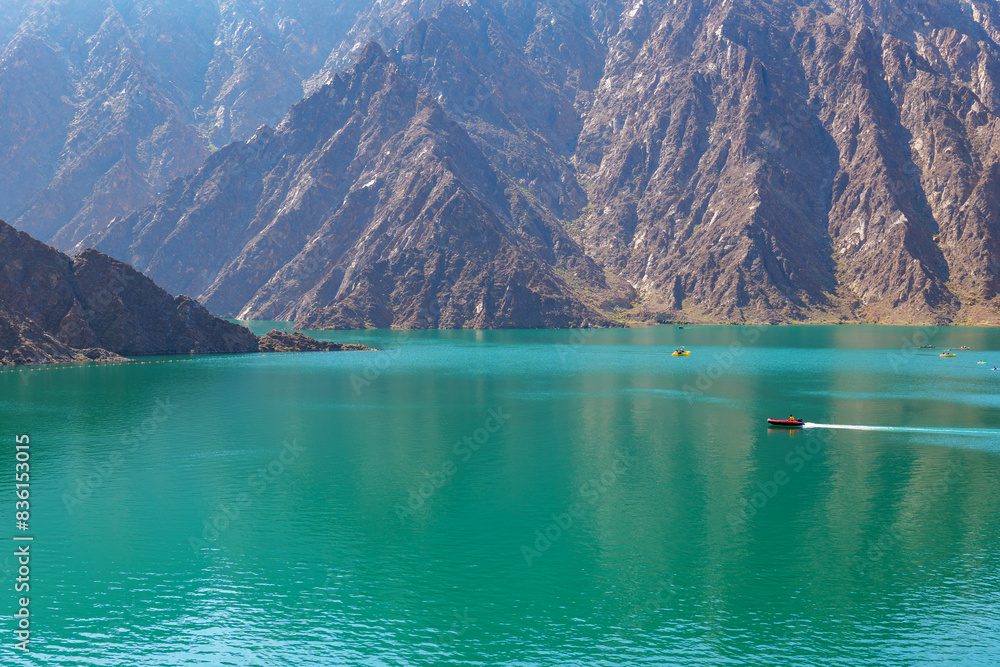 landscape view of Hatta dam lake and Hajar mountain in the Dubai, United Arab Emirates landscape view of Hatta dam lake and Hajar mountain in the Dubai, United Arab Emirates