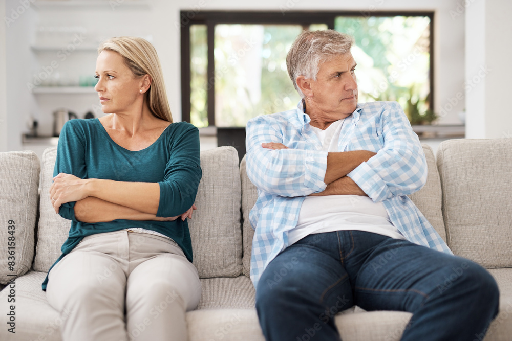 Mature, married and couple fight on sofa in home, people and domestic issue or ignore for infidelity. Crossed arms, frustrated and conflict in living room together, divorce and relationship drama Mature, married and couple fight on sofa in home, people and domestic issue or ignore for infidelity. Crossed arms, frustrated and conflict in living room together, divorce and relationship drama