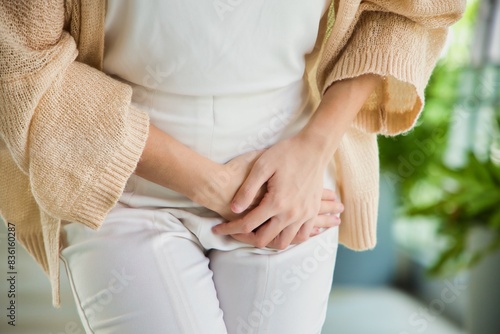 Healthcare Concept Image, Asian woman holding her pee, health care concept of UTI urinary tract infection; urinary incontinence; overactive bladder symptoms, isolated background