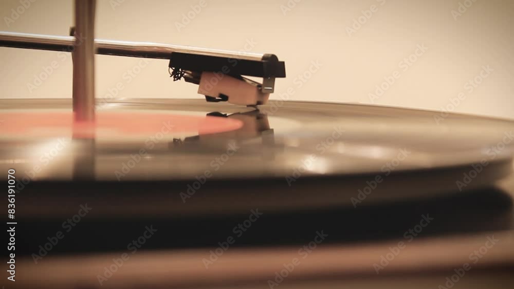 Dropping stylus needle on vinyl record playing 4K video Dropping stylus needle on vinyl record playing 4K video