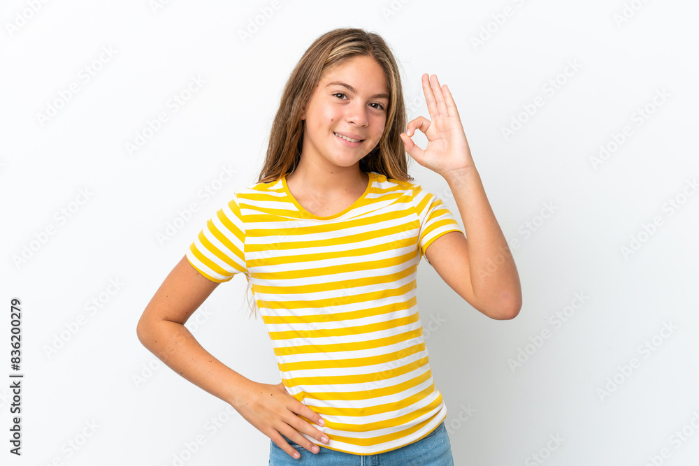 Little caucasian girl isolated on white background showing ok sign with fingers Little caucasian girl isolated on white background showing ok sign with fingers