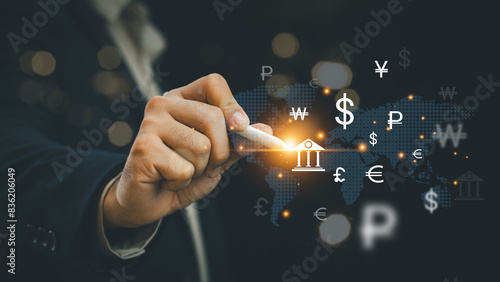 Foto Global currency exchange concept, Businessman holding virtual world map and dollar yuan yen euro and pound sterling sign