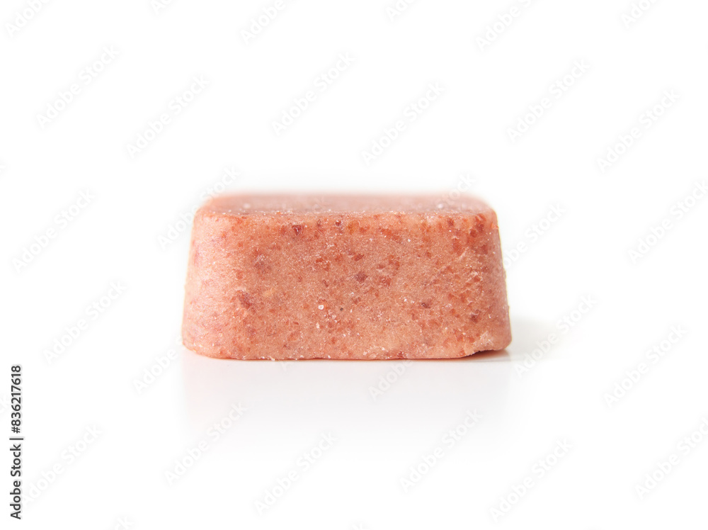 Dog flea and tick medication. Large chew tablet or chewable. Monthly treatment for dogs and puppies for protection and control of parasites. Selective focus. White background. Dog flea and tick medication. Large chew tablet or chewable. Monthly treatment for dogs and puppies for protection and control of parasites. Selective focus. White background.