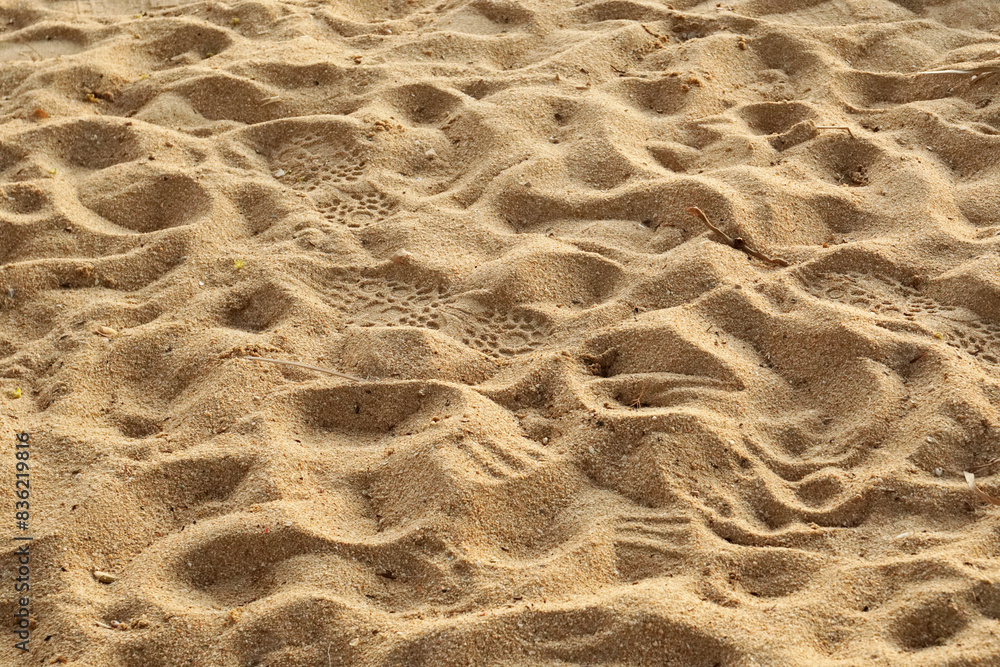 Fototapeta premium Closeup brown sand beach surface on the beach of thailand 