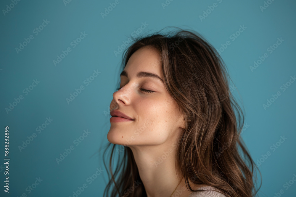 A close up of a woman's face with her eyes closed looking to a side A close up of a woman's face with her eyes closed looking to a side
